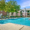 a swimming pool in front of a building