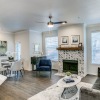 a living room with a couch and chairs