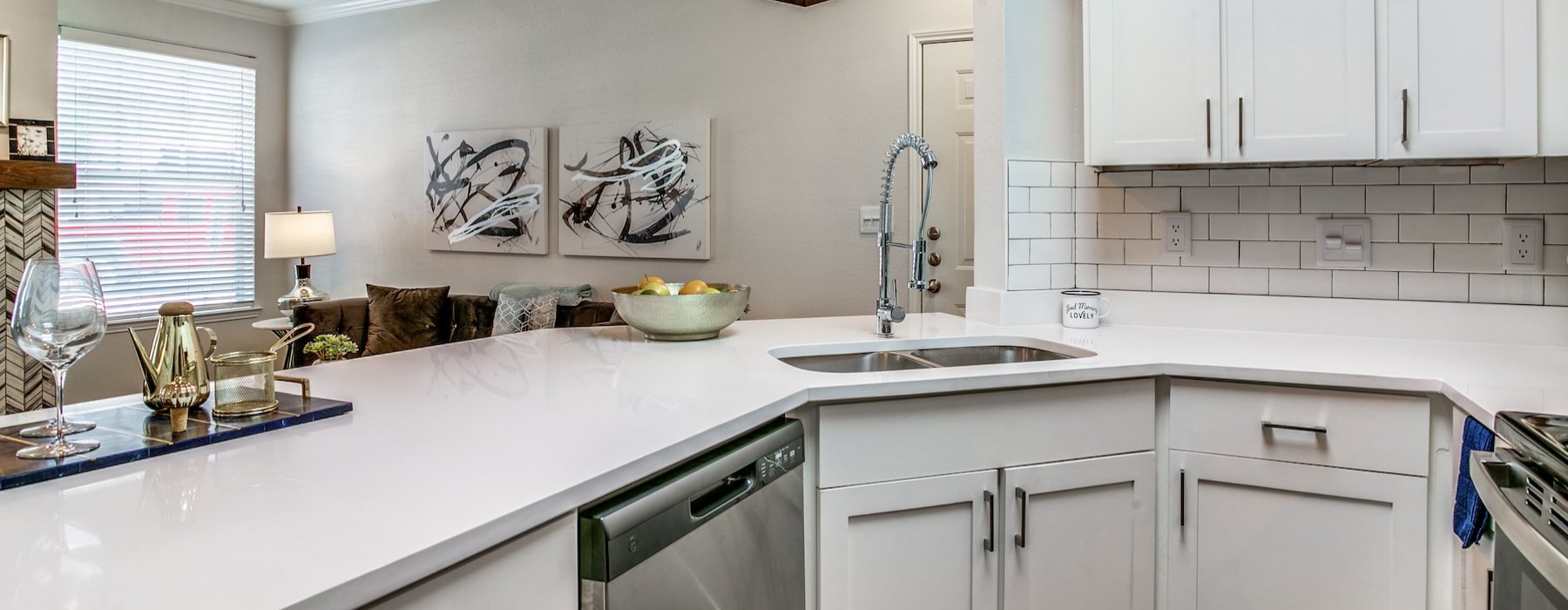 a kitchen with white cabinets