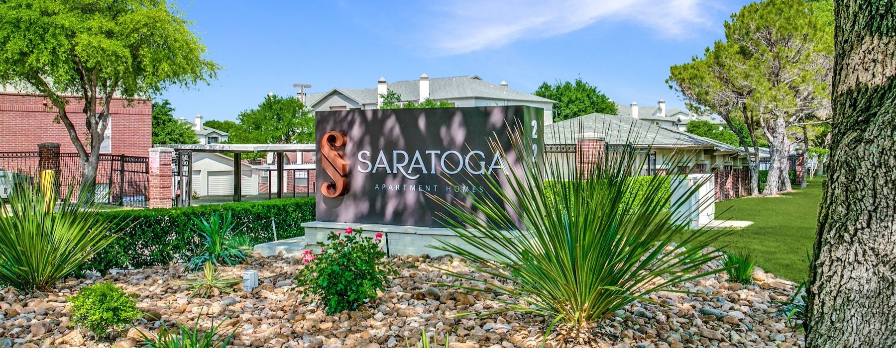 The essence of exceptional living a sign in a garden