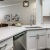 a kitchen with white cabinets