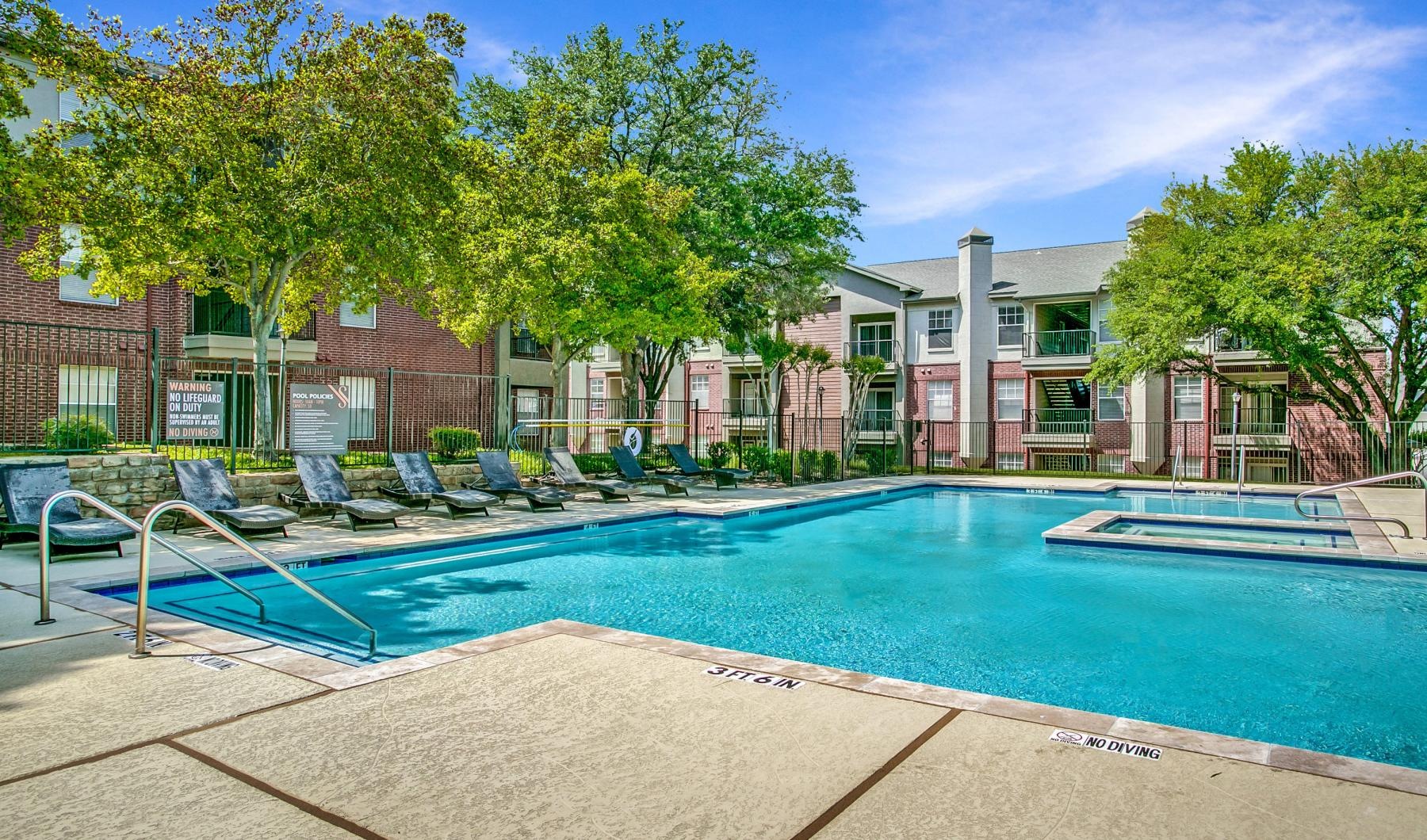 a swimming pool in front of a building
